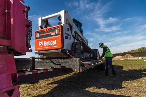 driving a skid steer loader|how to load a skid steer.